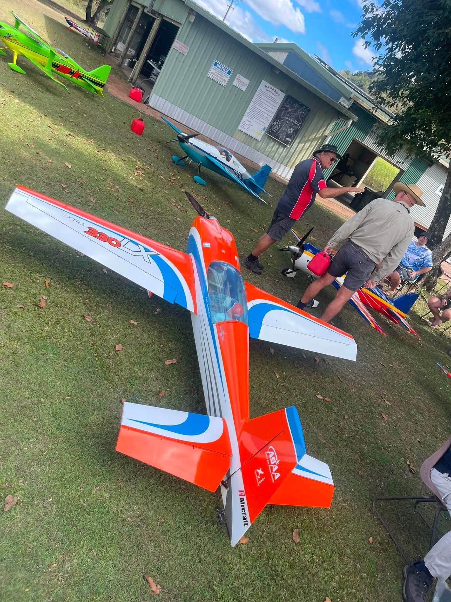 Orange and White Extra 330LX Aerobatic Plane
